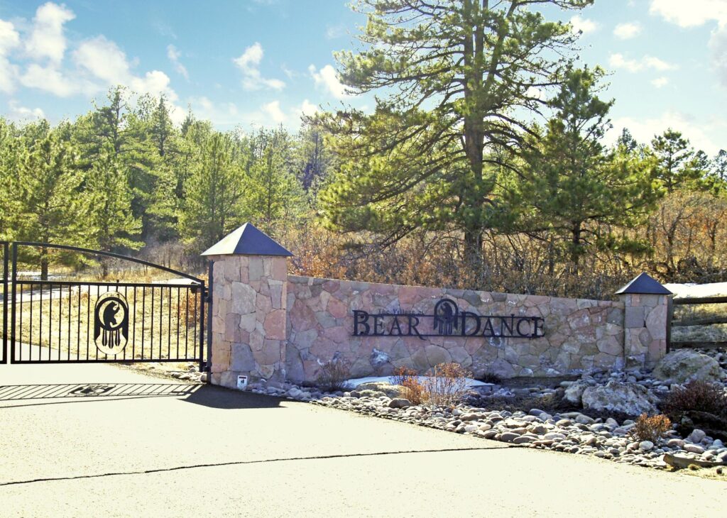 Gated stone entrance to the Bear Dance community in Larkspur, CO