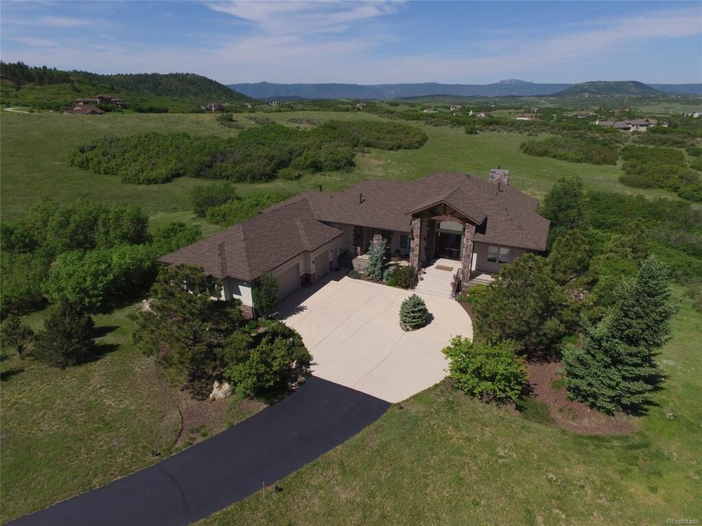 Aerial view of a mountain-craftsman home on Serenade Road in Bell Mountain Ranch with Front Range views, Castle Rock, CO