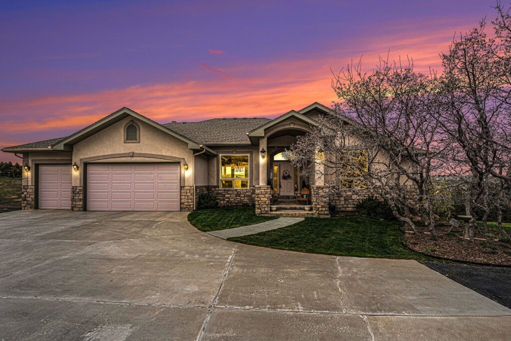 Twilight exterior of a home on Bell Mountain Drive in Bell Mountain Ranch, Castle Rock, CO