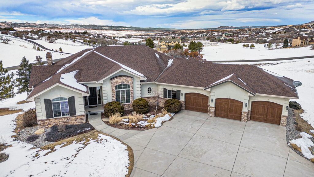 Aerial view of a ranch-style home on Hawken Drive in Keene Ranch, Castle Rock, CO