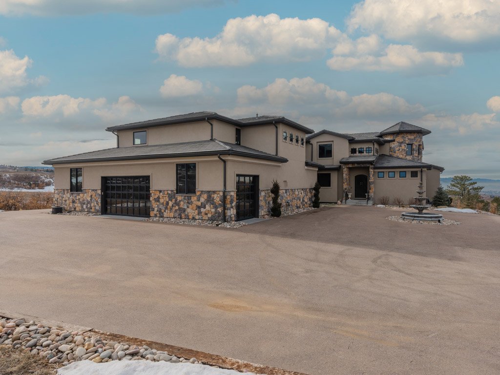 Stone and stucco estate home on acreage in Keene Ranch, Castle Rock, CO, sold by the Joan Pratt Group