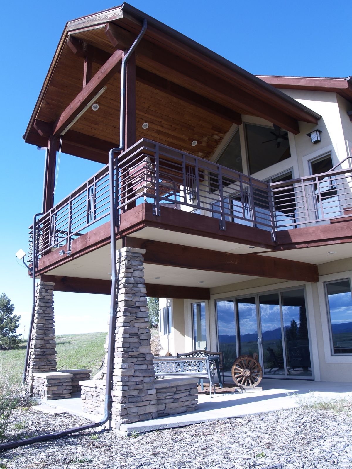 Sedalia, CO home with a covered deck and mountain views