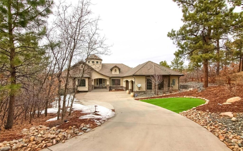 Custom home among ponderosa pines on Tulip Tree Place in Timber Canyon, Castle Rock, CO, sold by the Joan Pratt Group